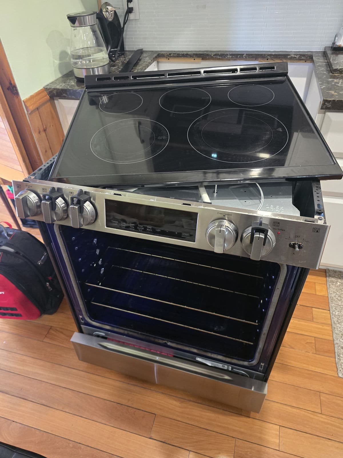 LG electric cooktop repair with the glass lifted