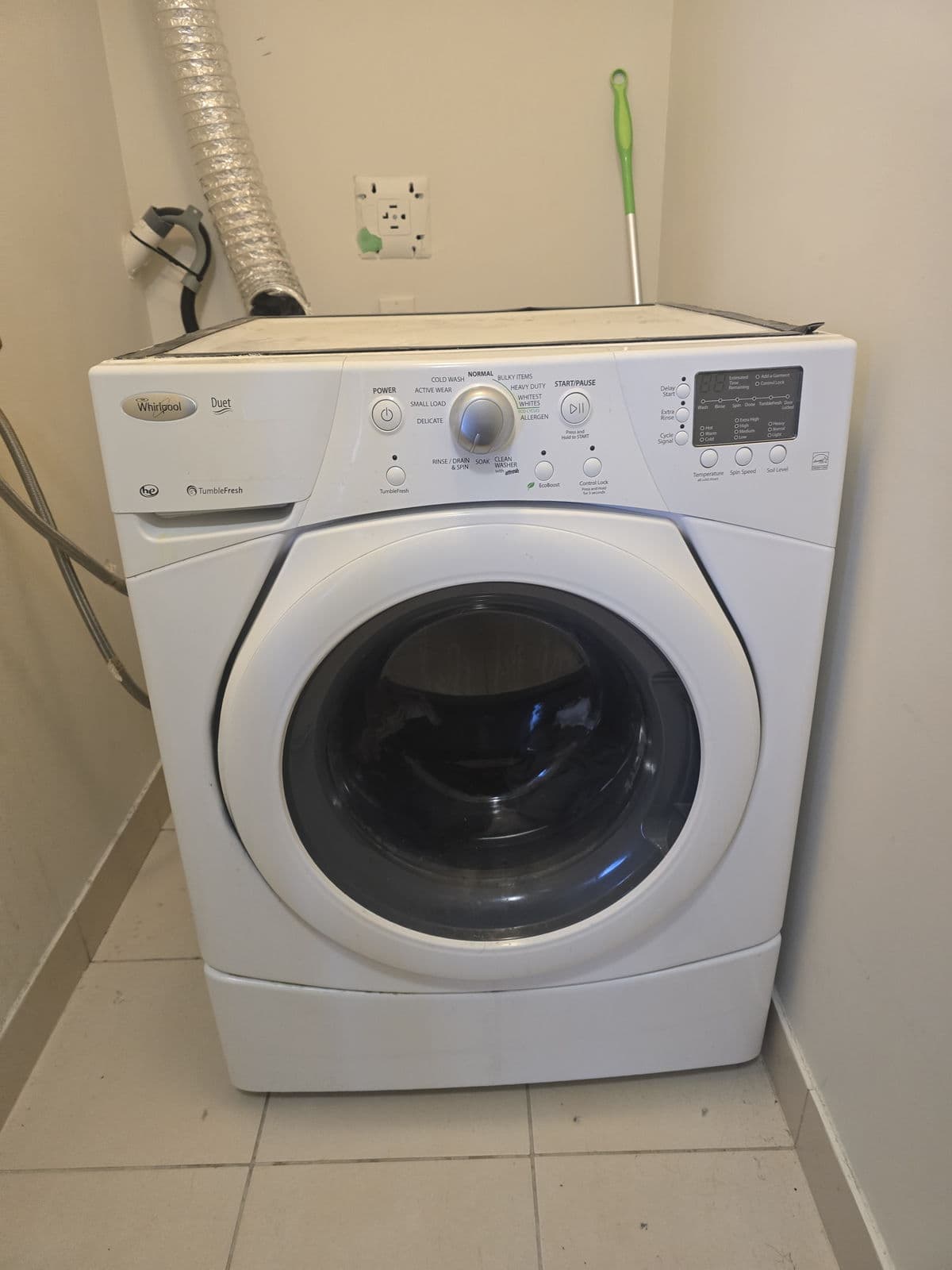 Whirlpool washer repair in a home laundry room
