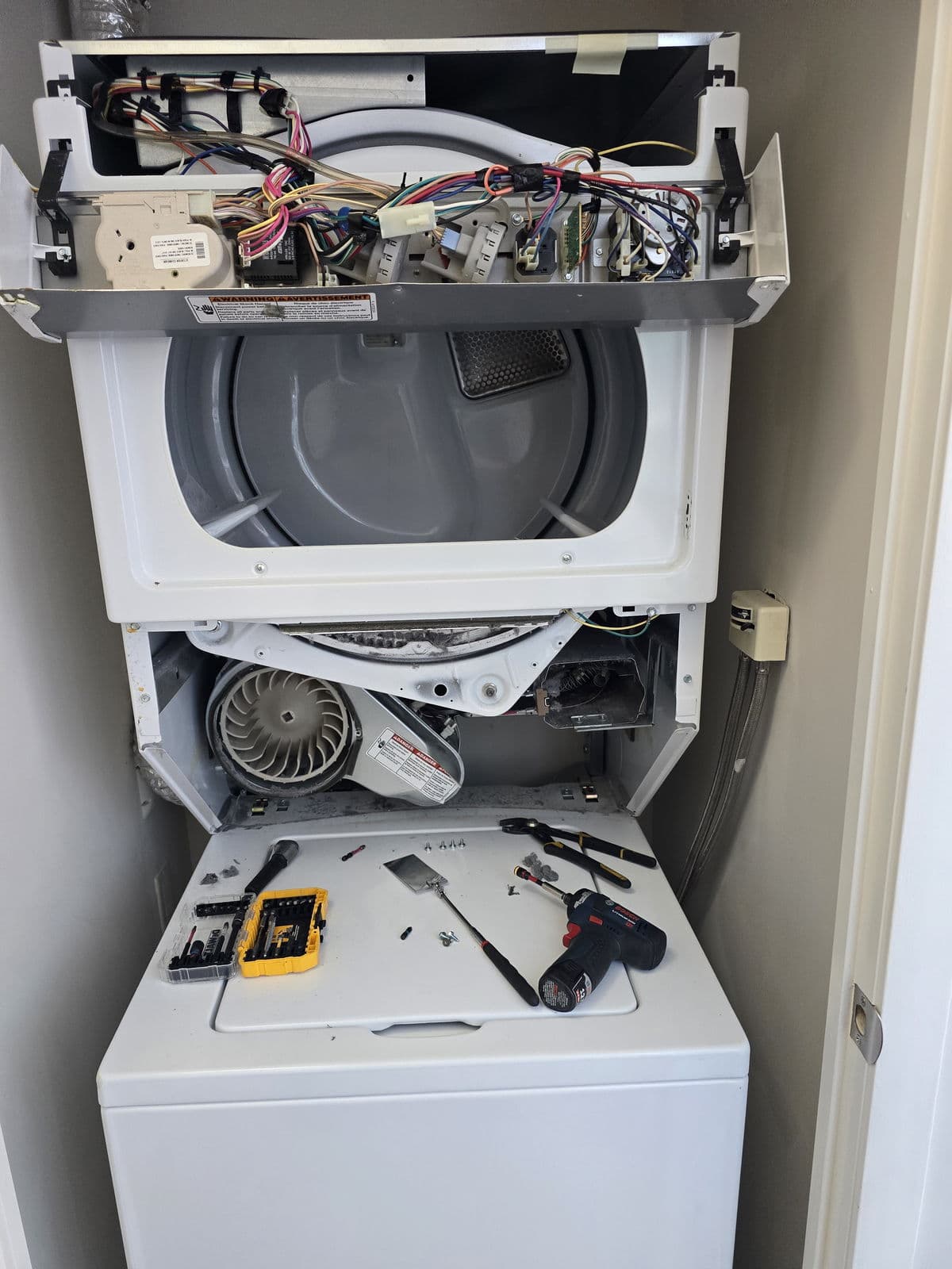 Stacked dryer repair in a Pickering laundry closet
